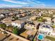 Beautiful aerial view of the homes, backyards, and neighborhood, some with pools, with mountains in the distance at 8112 Sapphire Sea St, North Las Vegas, NV 89085