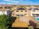 Aerial view of home and neighborhood with solar panels, covered patio and brick area at 8112 Sapphire Sea St, North Las Vegas, NV 89085