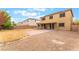 Large backyard featuring a covered patio and brick area, ideal for outdoor dining and entertaining at 8112 Sapphire Sea St, North Las Vegas, NV 89085