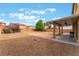 Expansive backyard with a covered patio and brick area, ideal for outdoor entertaining and relaxation at 8112 Sapphire Sea St, North Las Vegas, NV 89085