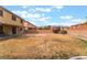 Large backyard with a covered patio and brick area, offering ample space for outdoor activities at 8112 Sapphire Sea St, North Las Vegas, NV 89085