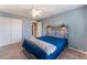 Relaxing bedroom with carpet flooring, a ceiling fan, and closet at 8112 Sapphire Sea St, North Las Vegas, NV 89085