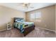 Comfortable bedroom with carpet flooring, a queen bed and view of the neighborhood at 8112 Sapphire Sea St, North Las Vegas, NV 89085