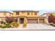 Inviting two-story home with well-maintained desert landscaping and a convenient three-car garage at 8112 Sapphire Sea St, North Las Vegas, NV 89085