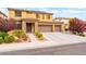 Charming two-story home with desert landscaping and a wide driveway, perfect for Gathering living at 8112 Sapphire Sea St, North Las Vegas, NV 89085