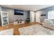 Comfortable living room showcasing elegant wood floors, a large rug, and modern decor at 8112 Sapphire Sea St, North Las Vegas, NV 89085