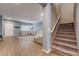 Open-concept living room featuring stylish wood floors and staircase, perfect for entertaining at 8112 Sapphire Sea St, North Las Vegas, NV 89085