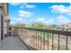 Balcony offering railings and views of neighborhood and blue skies at 8658 Tom Noon Ave # 103, Las Vegas, NV 89178