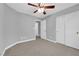Bedroom with neutral walls, carpeted floor, ceiling fan, and closets at 8658 Tom Noon Ave # 103, Las Vegas, NV 89178