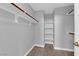 Walk-in closet features closet rod, shelving, and neutral paint at 8658 Tom Noon Ave # 103, Las Vegas, NV 89178