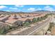 Aerial shot of the community's layout with beige townhomes, drought resistant landscaping, and convenient walking paths at 8658 Tom Noon Ave # 103, Las Vegas, NV 89178