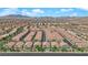An aerial view shows a community offering low-maintenance desert landscaping and a desirable neighborhood layout at 8658 Tom Noon Ave # 103, Las Vegas, NV 89178