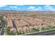 Aerial shot of the community showcasing its desert landscaping, well-maintained homes, and easy access to nearby roads at 8658 Tom Noon Ave # 103, Las Vegas, NV 89178