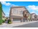 Charming two-story home with attached two-car garage, balcony and landscaped front yard at 8658 Tom Noon Ave # 103, Las Vegas, NV 89178