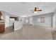 Bright living area flowing into the kitchen with views of the yard through sliding glass doors at 8658 Tom Noon Ave # 103, Las Vegas, NV 89178