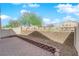 The back patio includes a rock garden, red brick detail, and partial fencing at 8658 Tom Noon Ave # 103, Las Vegas, NV 89178