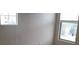 Bedroom with natural light from two windows and neutral wall color at 8970 Flying Frog Ave, Las Vegas, NV 89148