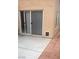 Outdoor patio area with concrete flooring and a sliding glass door, leading to indoor living spaces at 8970 Flying Frog Ave, Las Vegas, NV 89148