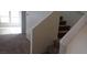 Carpeted staircase with white railing, leading to the upper level of the home at 8970 Flying Frog Ave, Las Vegas, NV 89148