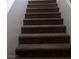 Carpeted staircase with neutral walls offers safe transition between floors at 8970 Flying Frog Ave, Las Vegas, NV 89148