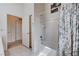 Bathroom featuring a tub with a shower, and a doorway to adjacent rooms at 8985 S Durango Dr # 2014, Las Vegas, NV 89113