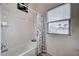 Well-lit bathroom with a tub and shower featuring decorative shower curtain at 8985 S Durango Dr # 2014, Las Vegas, NV 89113