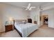 Bright bedroom with a ceiling fan and connections to bathroom and closet at 8985 S Durango Dr # 2014, Las Vegas, NV 89113
