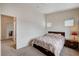 This bedroom boasts neutral walls, a full bed, and cozy carpet, creating a relaxing atmosphere at 8985 S Durango Dr # 2014, Las Vegas, NV 89113