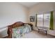 Cozy bedroom featuring a daybed, neutral carpet, and natural light from the window at 8985 S Durango Dr # 2014, Las Vegas, NV 89113