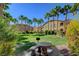 Lush green community space featuring picnic tables and palm trees at 8985 S Durango Dr # 2014, Las Vegas, NV 89113