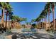 Community pool with lounge chairs and landscaping at 8985 S Durango Dr # 2014, Las Vegas, NV 89113