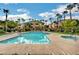 Community pool with lounge chairs and landscaping at 8985 S Durango Dr # 2014, Las Vegas, NV 89113