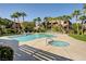 Community pool with lounge chairs and landscaping at 8985 S Durango Dr # 2014, Las Vegas, NV 89113