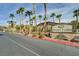 The Sunset Cliffs community offers a lush tropical landscape with tall palm trees at 8985 S Durango Dr # 2014, Las Vegas, NV 89113