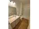 Well-lit bathroom featuring a single sink vanity and a shower-tub combination at 9050 W Warm Springs Rd # 1123, Las Vegas, NV 89148