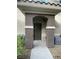 Inviting front entry featuring a covered porch with decorative pillars and a modern door at 9050 W Warm Springs Rd # 1123, Las Vegas, NV 89148