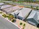 An aerial view showing modern home exterior with well-manicured landscaping at 9057 N Skye Treeline St, Las Vegas, NV 89166