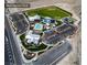 Bird's-eye view of Skye Canyon Park featuring a sports field, jogging path, pool, fitness center, and recreational facilities at 9057 N Skye Treeline St, Las Vegas, NV 89166