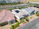 An aerial view showing modern home exterior with well-manicured landscaping at 9057 N Skye Treeline St, Las Vegas, NV 89166
