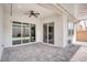 Spacious covered patio area with outdoor ceiling fans and stone pavers at 9057 N Skye Treeline St, Las Vegas, NV 89166
