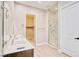 Ensuite bathroom with double sinks, walk-in closet, and glass shower at 9057 N Skye Treeline St, Las Vegas, NV 89166