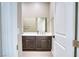 Bathroom featuring a contemporary vanity with dark wood cabinets, a modern countertop, and fixtures at 9057 N Skye Treeline St, Las Vegas, NV 89166