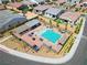 Overhead view of a community pool with lounge seating and shaded areas, perfect for relaxation and socializing at 9057 N Skye Treeline St, Las Vegas, NV 89166