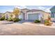 Charming single-story home with desert landscaping, a two-car garage, and a modern stucco facade at 9057 N Skye Treeline St, Las Vegas, NV 89166