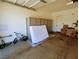 A well-lit two-car garage has ample space for parking and storage at 9057 N Skye Treeline St, Las Vegas, NV 89166