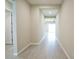 Bright hallway with neutral paint, leading to a large open living space at 9057 N Skye Treeline St, Las Vegas, NV 89166