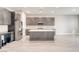 Spacious kitchen featuring a large island, stainless steel appliances, and ample cabinet space at 9057 N Skye Treeline St, Las Vegas, NV 89166