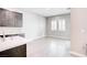 Bright kitchen area with modern cabinets, herringbone backsplash, and ample counter space at 9057 N Skye Treeline St, Las Vegas, NV 89166