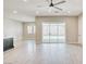 Spacious living space with large sliding glass doors leading to the backyard and patio at 9057 N Skye Treeline St, Las Vegas, NV 89166