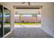 Covered patio with pavers, ceiling fans, and views of the landscaped backyard at 9057 N Skye Treeline St, Las Vegas, NV 89166